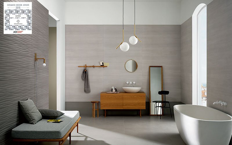 Materika, moving walls: 3D decoration on large, 6 mm thick ceramic tiles.