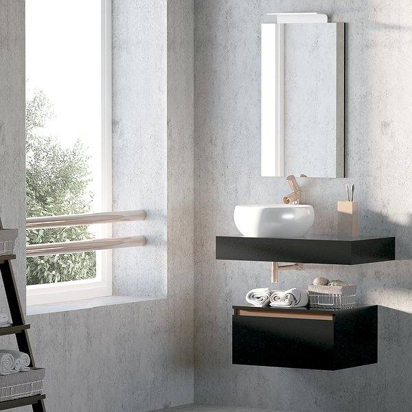 Ambiente Encimera con faldón negra mate con lavabo sobre encimera circular, espejo recto y aplique Lux blanco. Cajonera negra mate con regleta en cobre mate