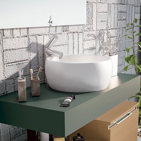 Encimera con faldón verde pizarra mate con lavabo sobre encimera circular