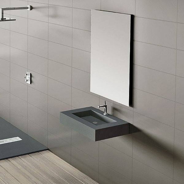 Lavabo encimera con faldón textura granito acabado cemento