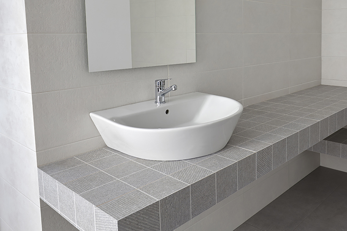 Lavabo de sobre-encimera 55x49 cm.